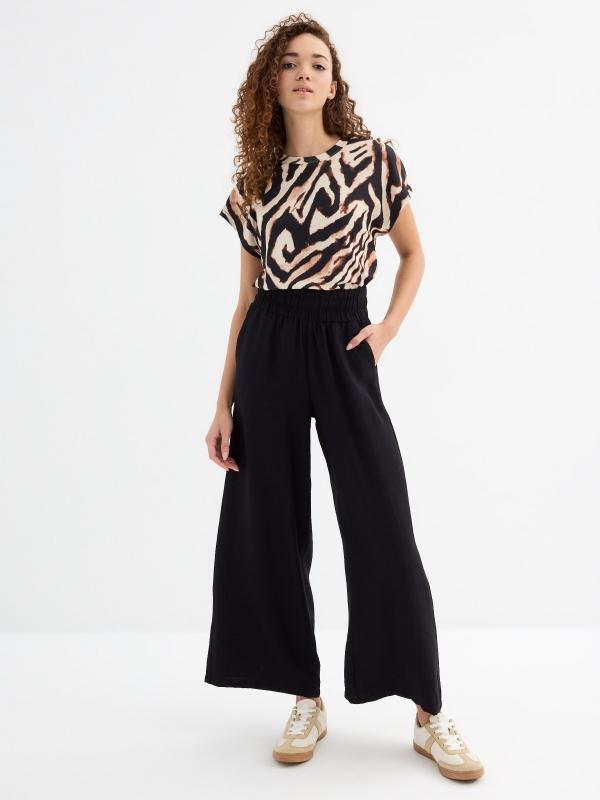 In side Pantalón wide leg fluido