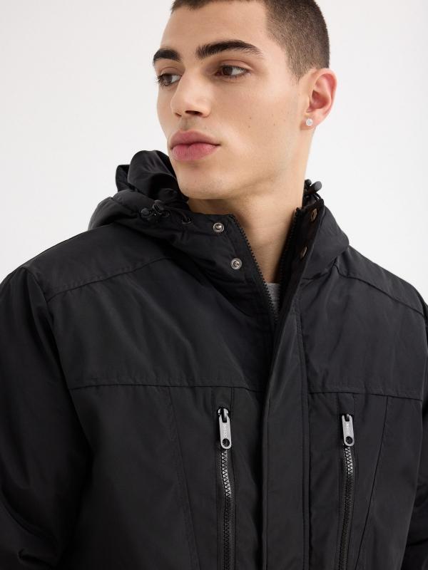 In side Parka negra capucha Descuento